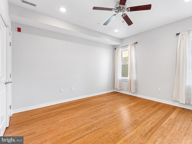 empty room with light hardwood / wood-style flooring and ceiling fan