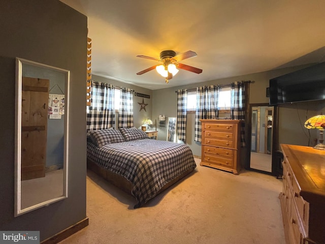 bedroom with ceiling fan and carpet floors