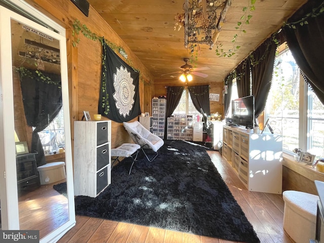 bedroom with multiple windows, wood ceiling, and hardwood / wood-style flooring