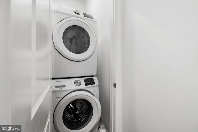 washroom with stacked washer / dryer