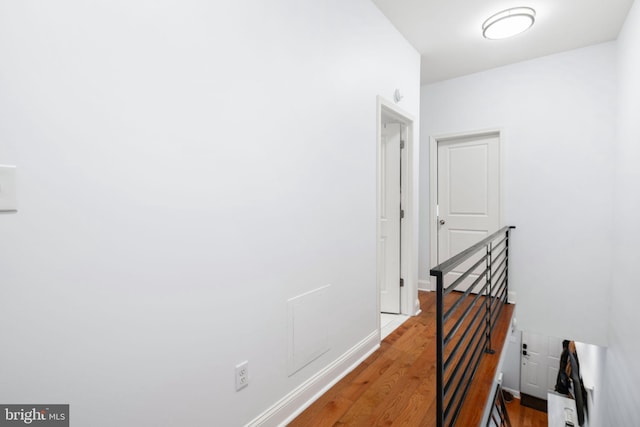 hallway featuring hardwood / wood-style flooring