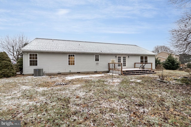 rear view of house with central AC unit and a deck