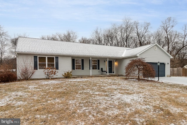 ranch-style house with a garage and a porch