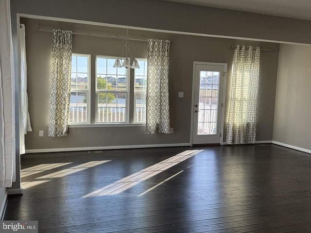 empty room featuring dark hardwood / wood-style floors