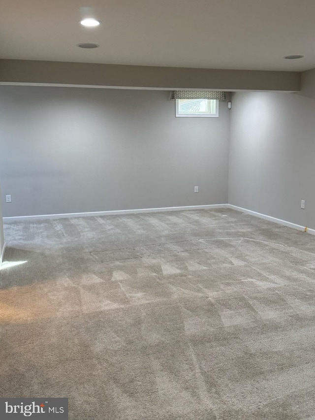 basement with light colored carpet