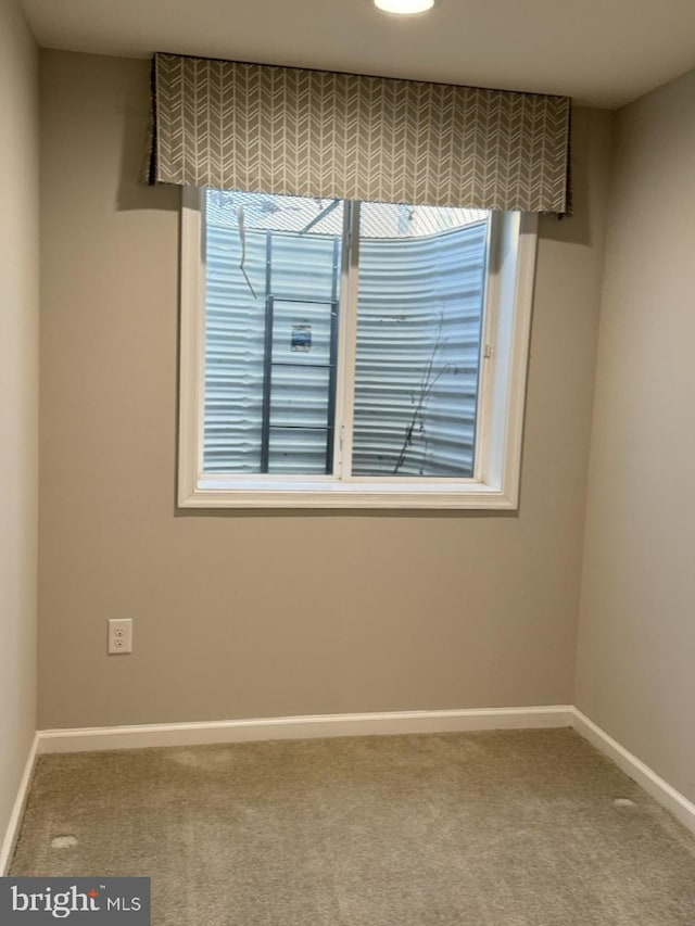 view of carpeted spare room