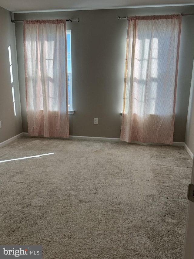 view of carpeted spare room