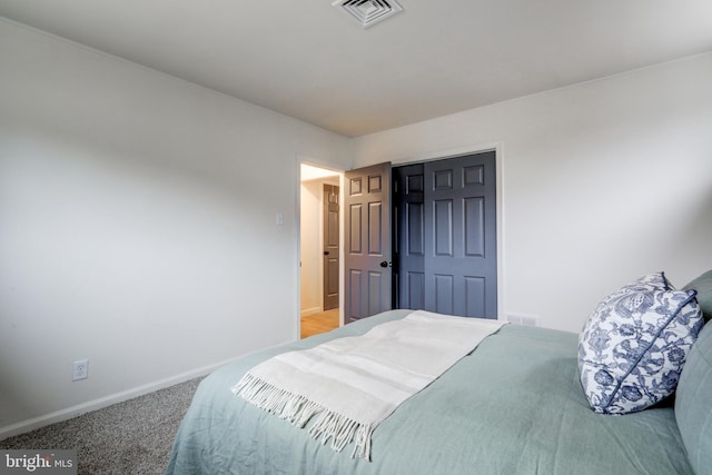 bedroom featuring carpet floors and a closet