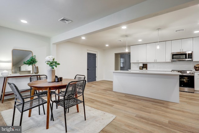 dining room featuring light wood-type flooring