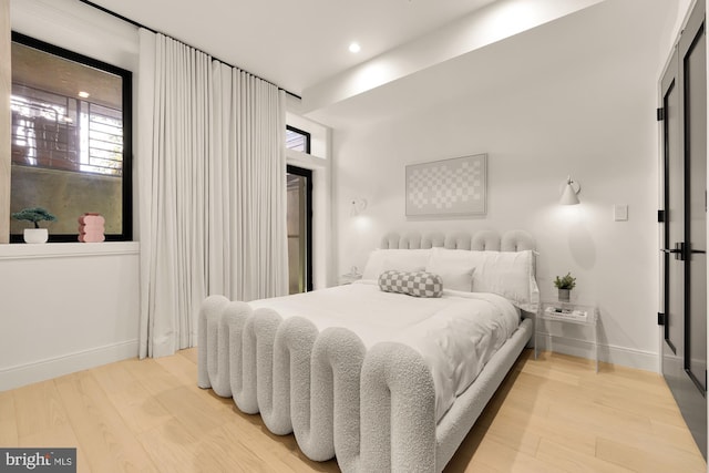 bedroom with wood-type flooring