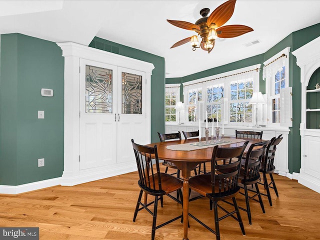 dining room featuring light hardwood / wood-style floors and ceiling fan