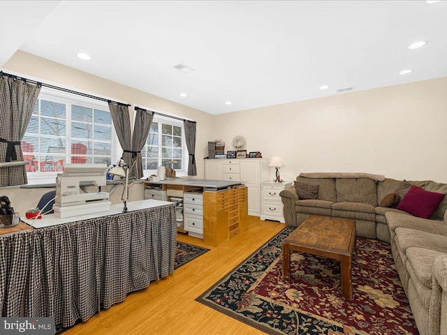 living room with light hardwood / wood-style floors