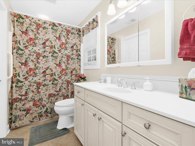 bathroom featuring vanity, a shower with curtain, tile patterned flooring, and toilet