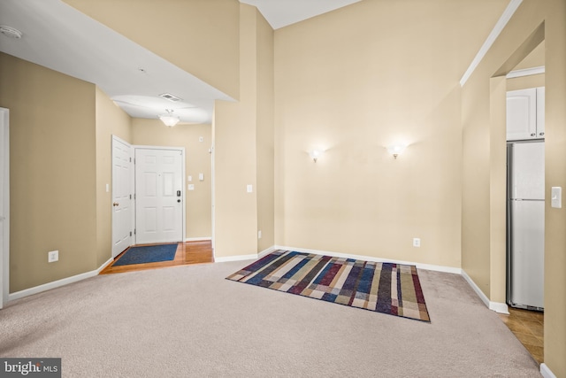 view of carpeted entrance foyer