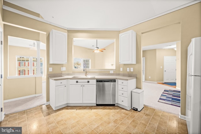 kitchen featuring stainless steel dishwasher, sink, white fridge, and white cabinets