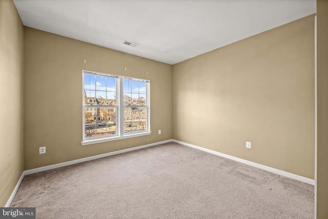 unfurnished room with carpet flooring