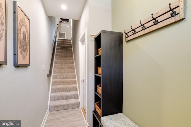 staircase featuring hardwood / wood-style floors