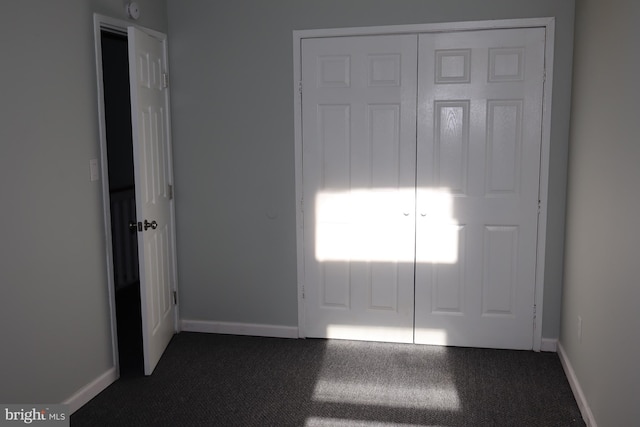 view of carpeted entrance foyer