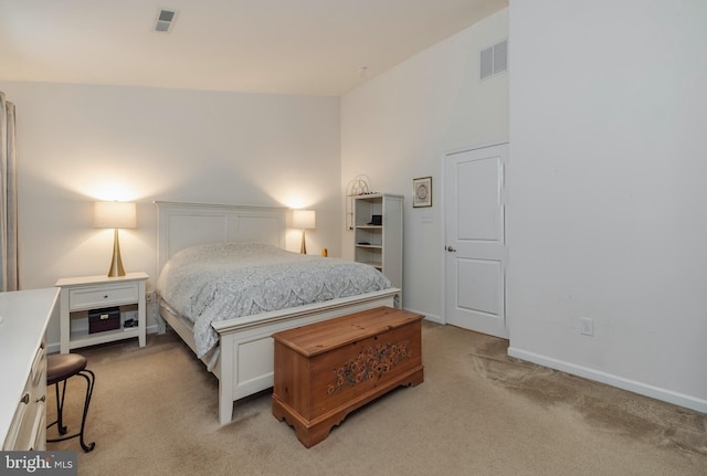 bedroom featuring light carpet