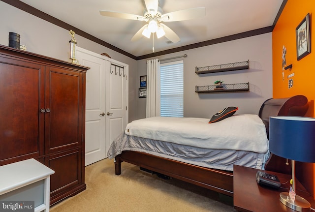 bedroom with crown molding, light colored carpet, and ceiling fan