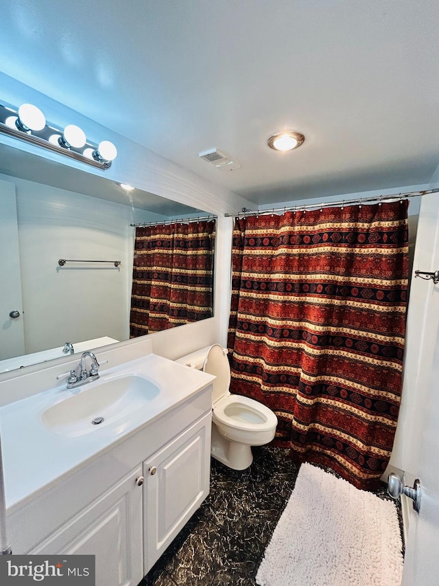 bathroom with vanity, toilet, and a shower with shower curtain