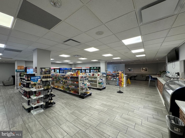 workout area featuring a paneled ceiling