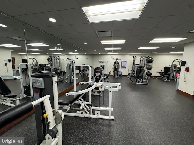 exercise room featuring a paneled ceiling