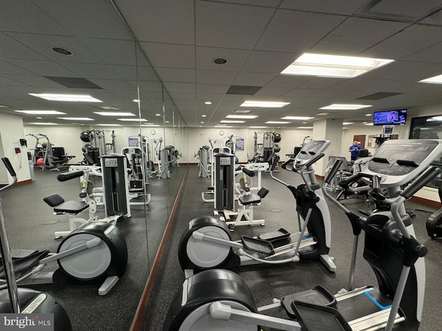 exercise room featuring a paneled ceiling