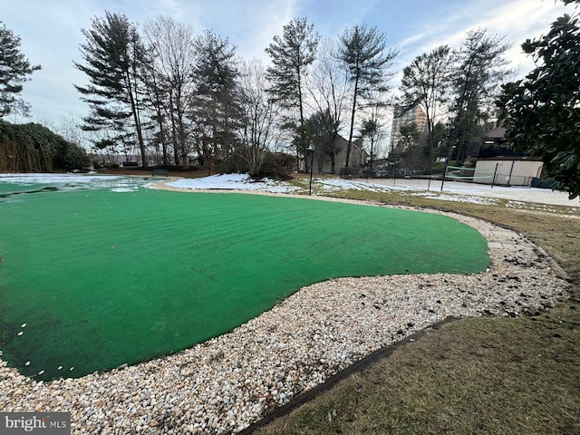 view of yard with tennis court