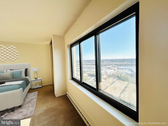 carpeted bedroom with baseboard heating