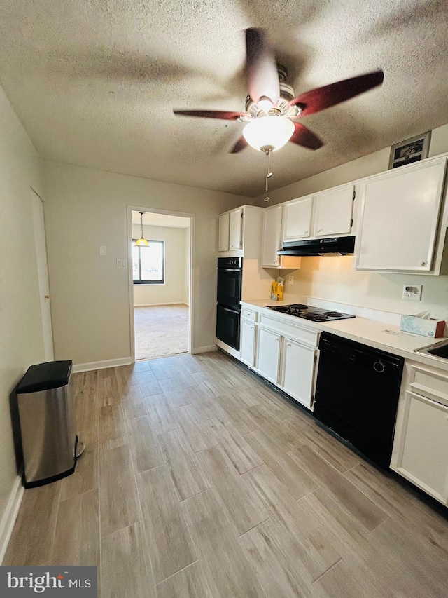 kitchen with a textured ceiling, light hardwood / wood-style flooring, white cabinets, ceiling fan, and black appliances