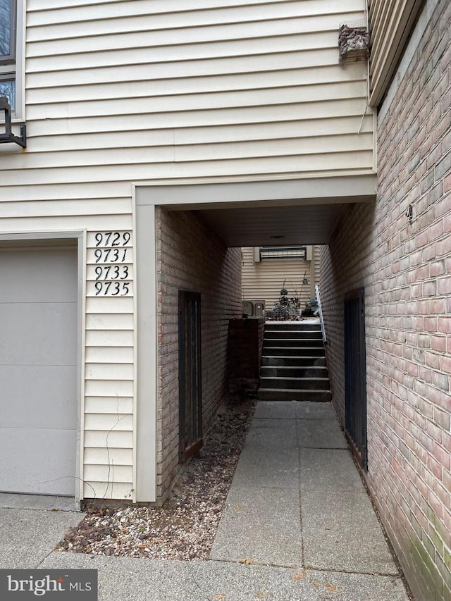 doorway to property featuring a garage