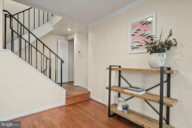 interior space featuring ornamental molding and hardwood / wood-style flooring