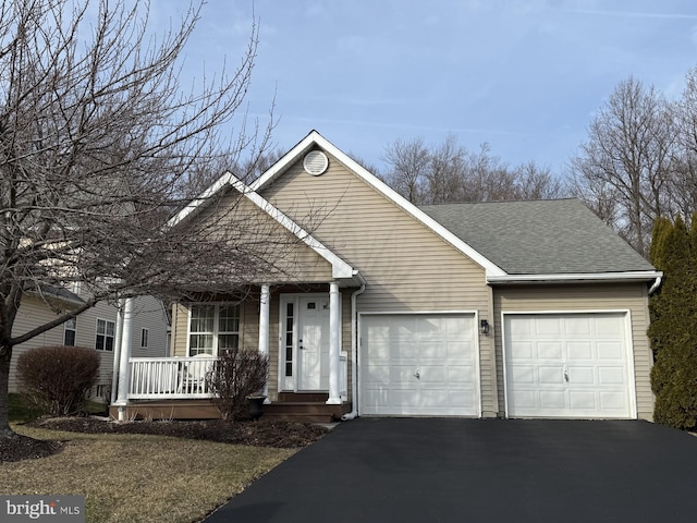 view of front facade featuring a garage and covered porch