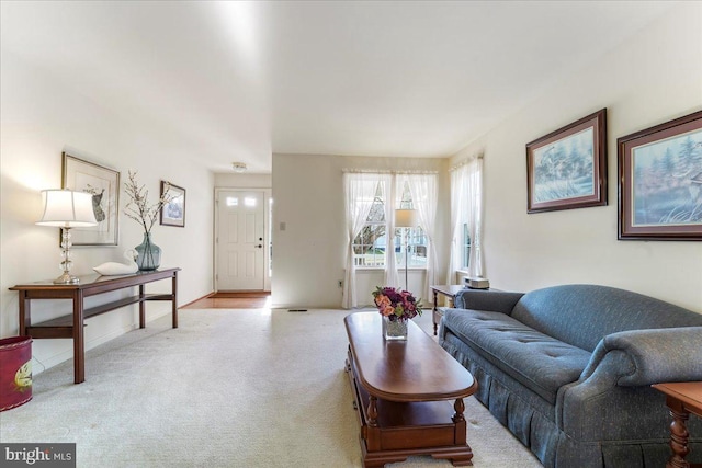 living room featuring light colored carpet