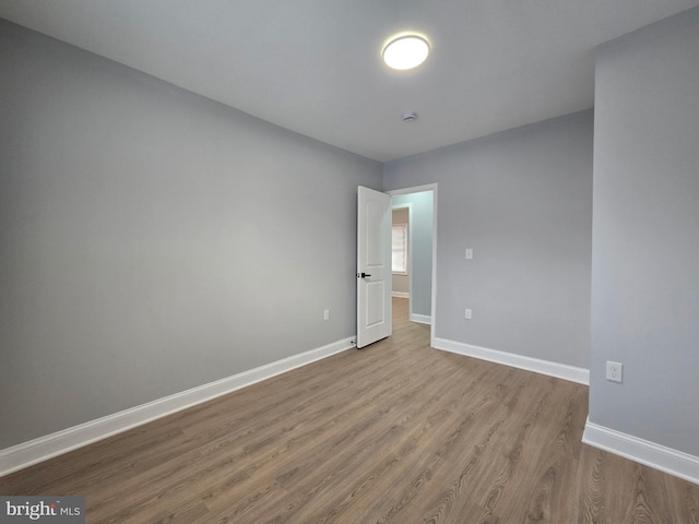 spare room with light hardwood / wood-style floors