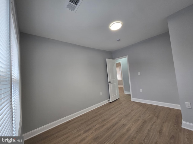 empty room with wood-type flooring