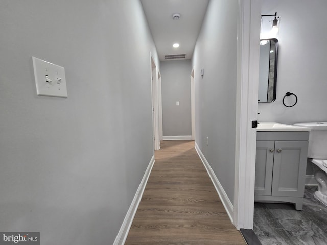 hall with dark hardwood / wood-style floors