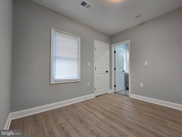 spare room featuring hardwood / wood-style flooring