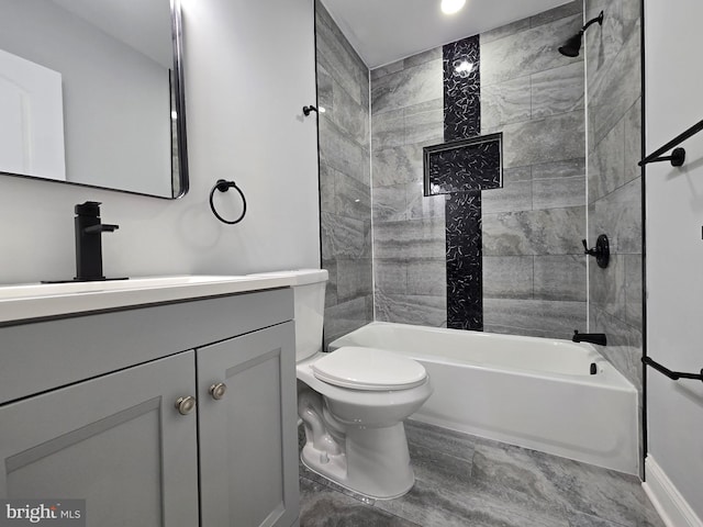 full bathroom with vanity, toilet, and tiled shower / bath combo