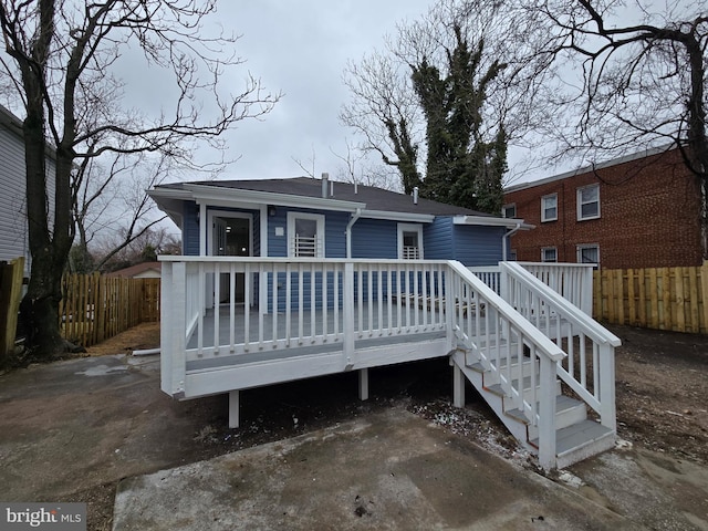 back of house with a wooden deck