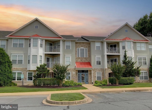 view of outdoor building at dusk