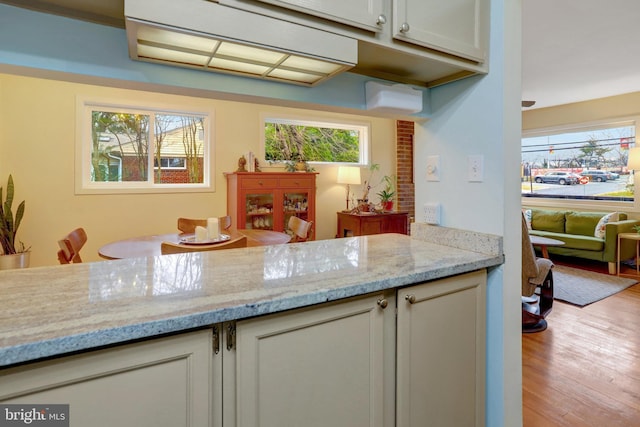 kitchen with light wood finished floors and light stone countertops