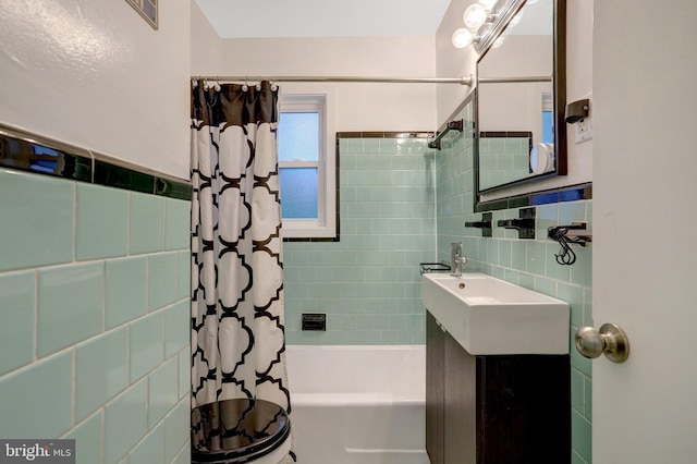 full bathroom featuring shower / bath combo and tile walls