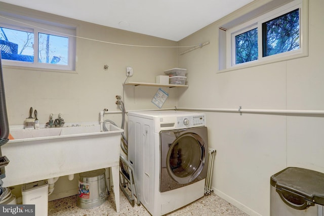 washroom featuring washer / dryer and laundry area