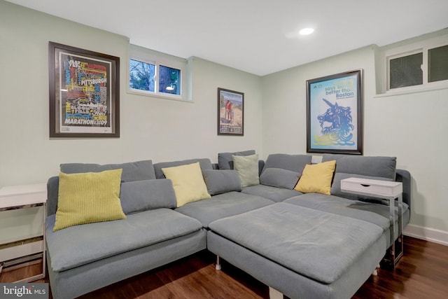 living room with recessed lighting, dark wood finished floors, and baseboards