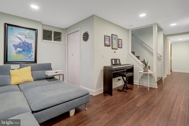 living room with stairs, baseboards, wood finished floors, and recessed lighting