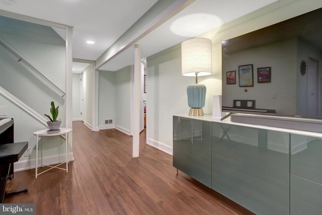 interior space featuring baseboards, visible vents, wood finished floors, and recessed lighting