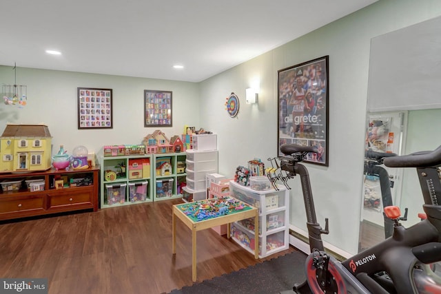 playroom with wood finished floors and recessed lighting