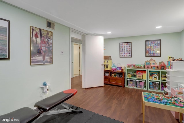 playroom featuring wood finished floors, visible vents, and recessed lighting